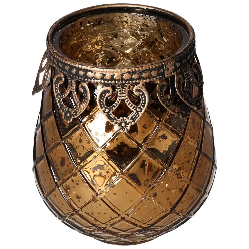 Ornate amber glass lantern with intricate metal rim detailing, showcasing a blend of elegance and luxury in spiritual decor.