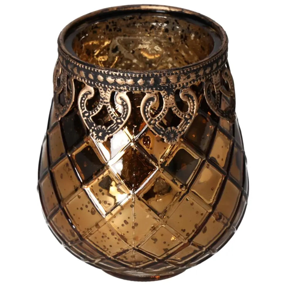 Elegant glass lantern with intricate metal rim, featuring a geometric design and warm amber glow, perfect for adding a touch of luxury.