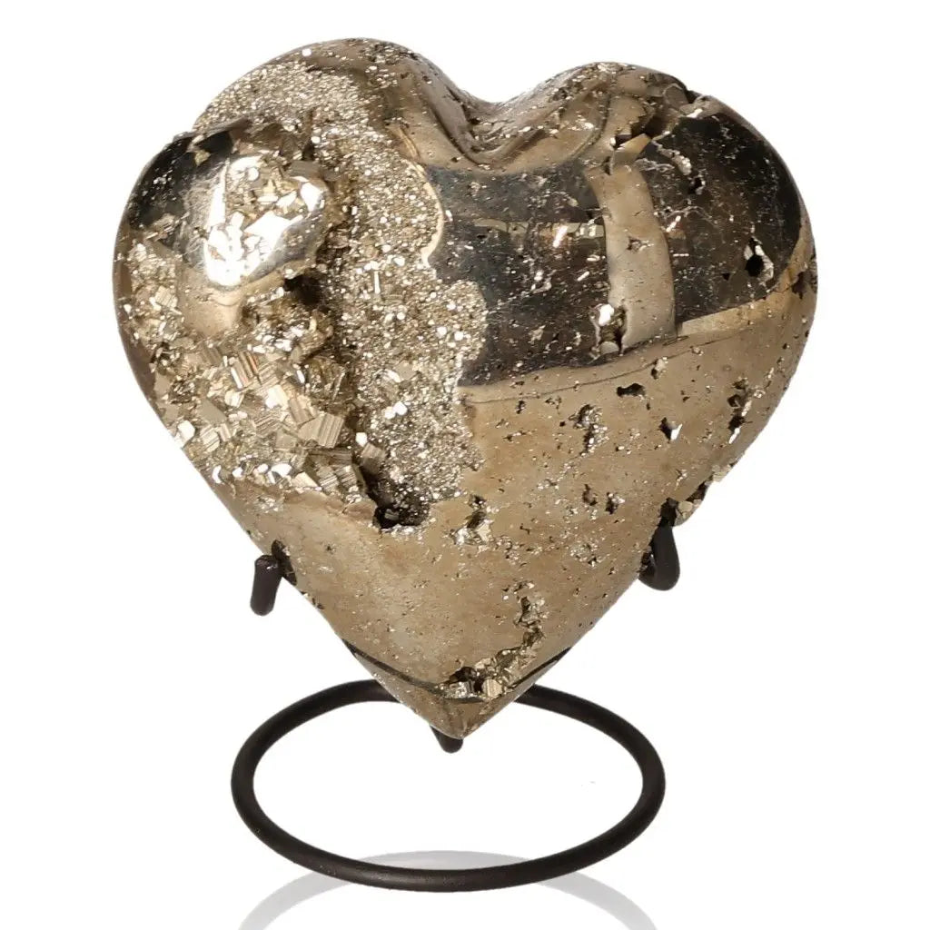 Pyrite heart-shaped mineral, resembling gold, with a metallic luster, symbolizing abundance and prosperity, displayed on a stand.