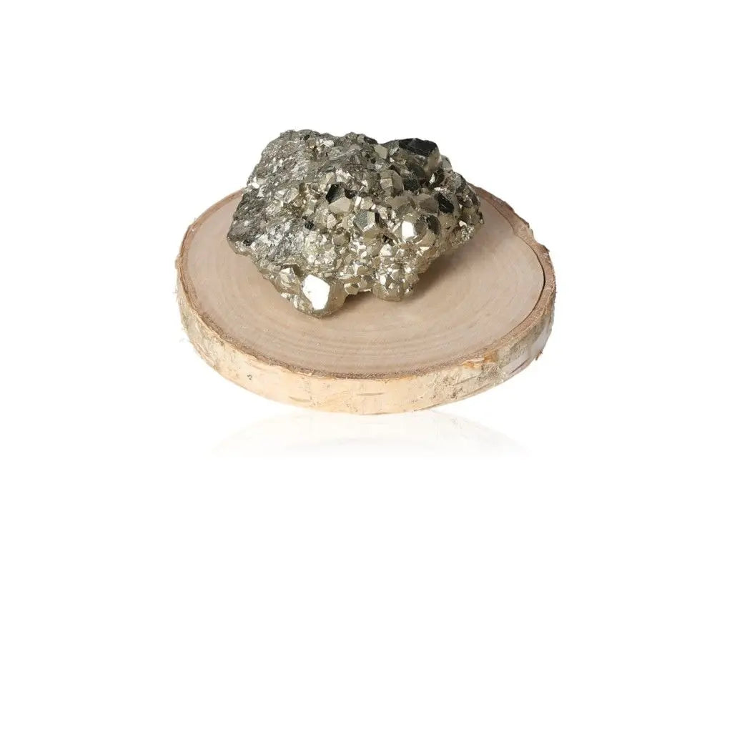 Pyrite druzy stone on wooden disk showcasing golden hue and metallic luster, symbolizing abundance and prosperity.