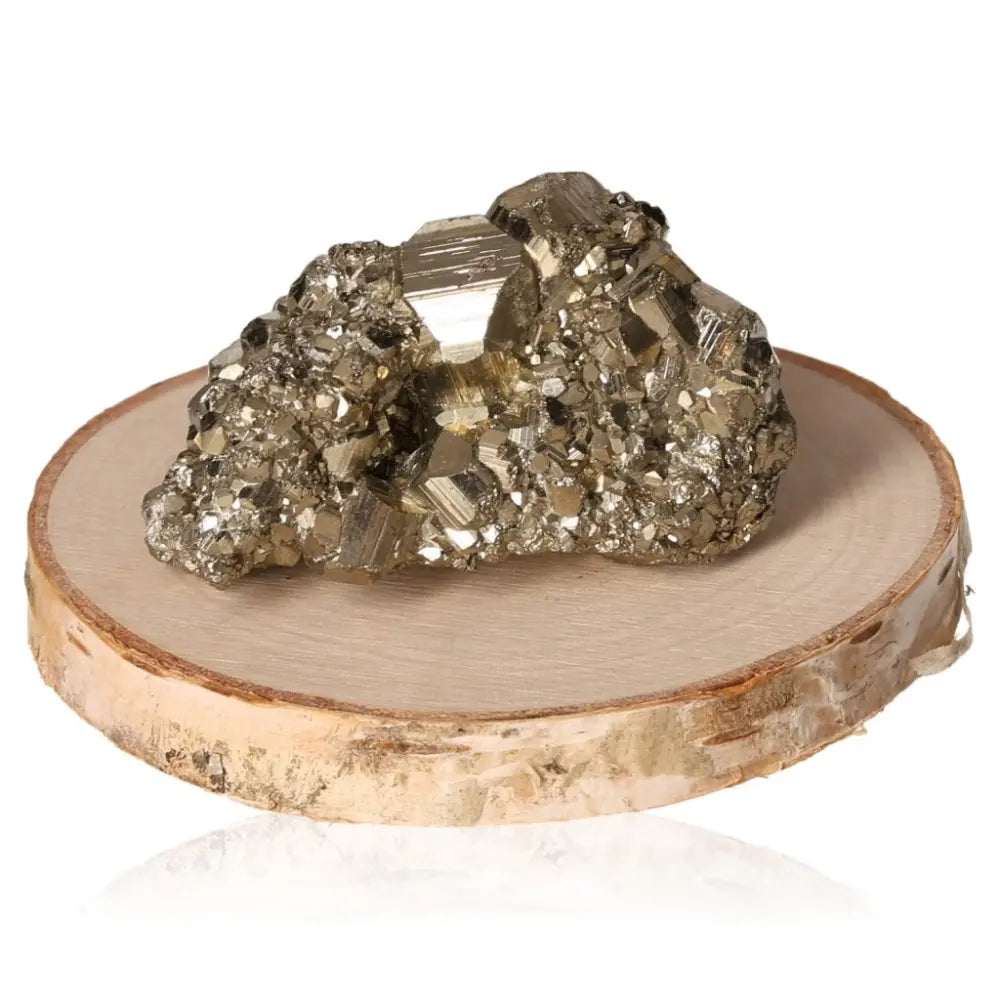 Close-up of a radiant golden pyrite druzy with metallic luster displayed on a wooden base, symbolizing abundance and prosperity.