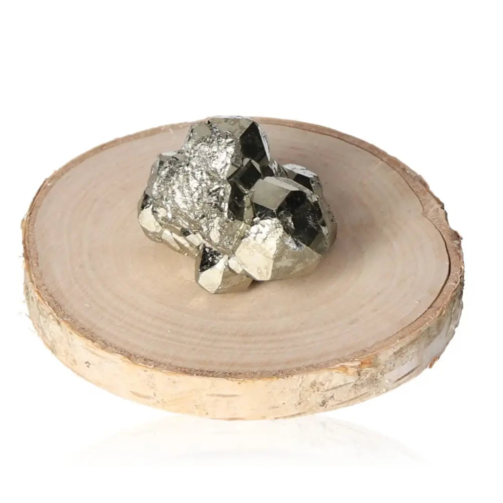 Pyrite druze with metallic luster on wooden display, symbolizing abundance and prosperity.