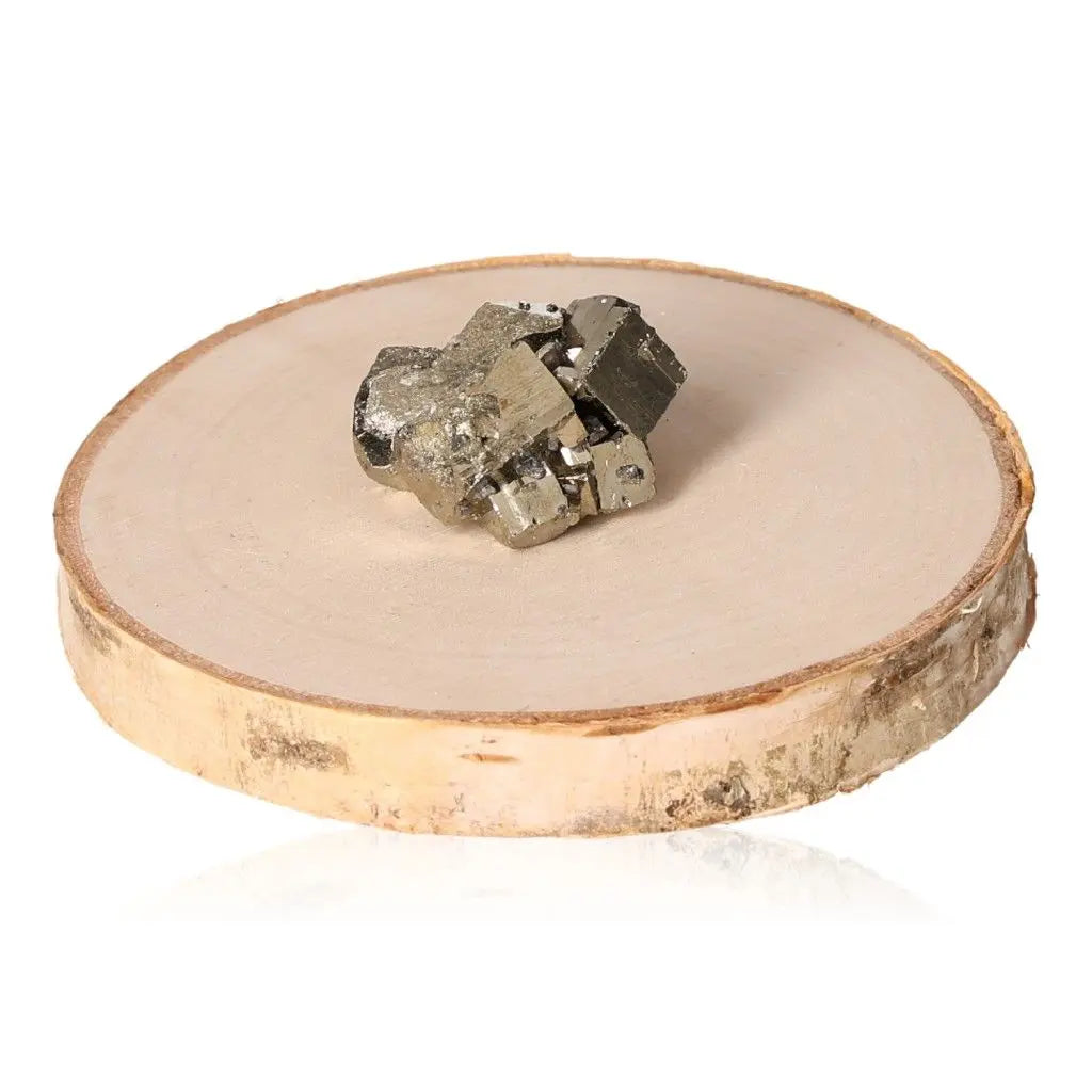 Pyrite crystal cluster on wooden base, showcasing its golden hue and metallic luster, symbolizing abundance and prosperity.