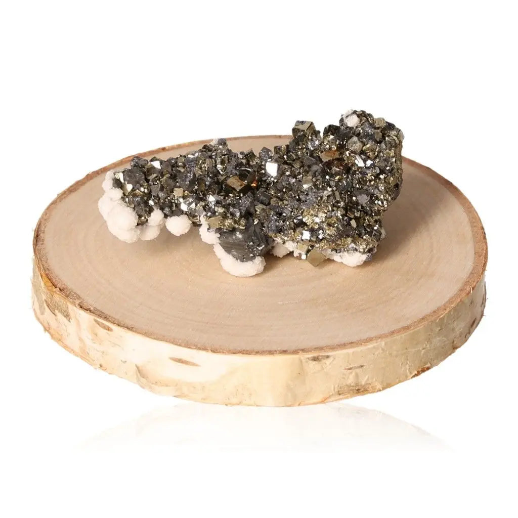 Pyrite druze crystal displaying metallic luster on wooden base, known as Fool’s Gold for its golden hue and symbolic prosperity.