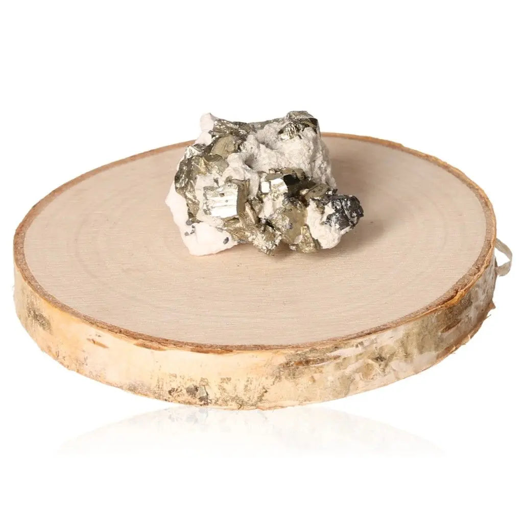 Pyrite druze on wooden disc, showcasing its metallic luster and golden hue, symbolizing abundance and prosperity.