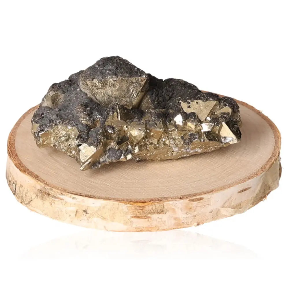 Golden Pyrite druze on a wooden slice, showcasing natural metallic luster, symbolizing abundance and prosperity.