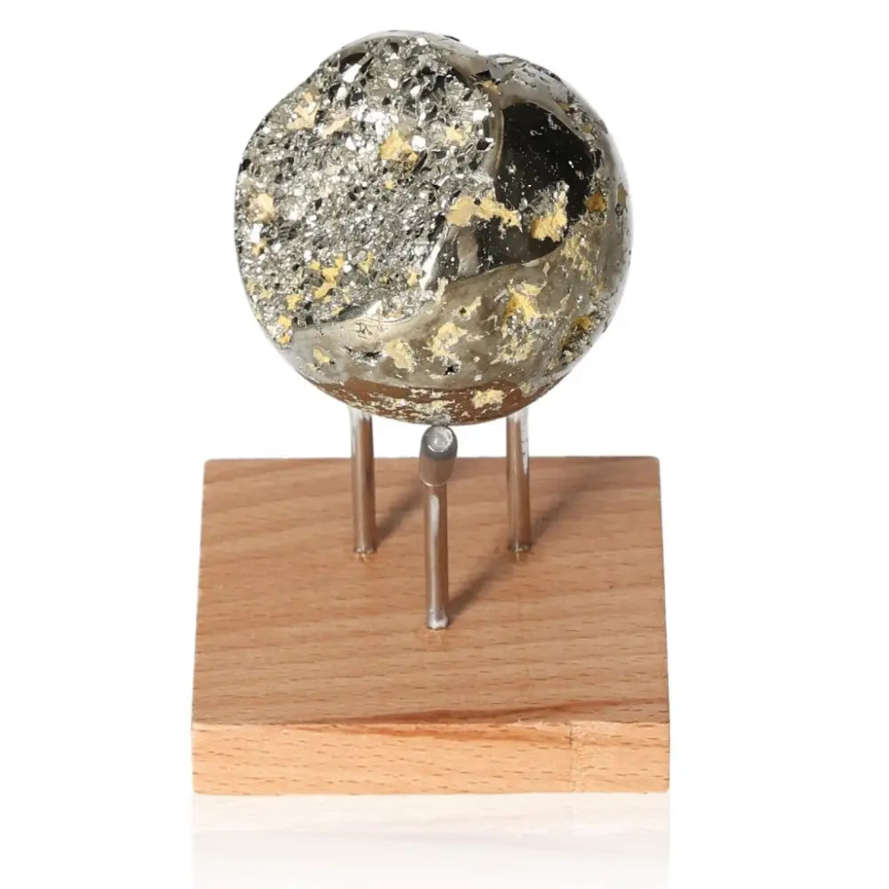 Stunning pyrite sphere on stand, displaying its golden hue and metallic luster, symbolizing abundance and prosperity.