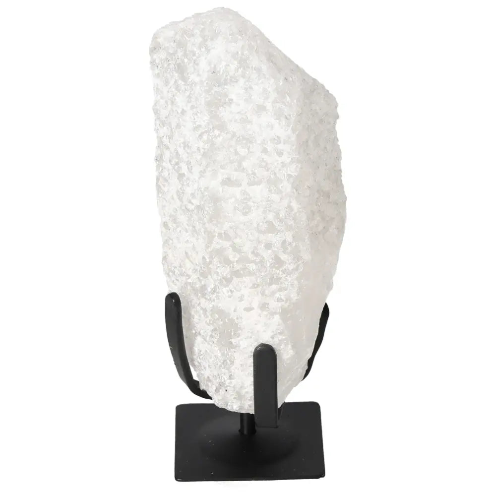 Quartz Crystal Bubble on stand, highlighting its unique color variations and energetic properties from Sylvia Crystals.