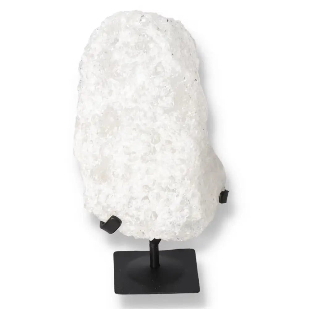 Quartz Crystal Bubble on display stand, featuring natural inclusions and unique colors for metaphysical growth.