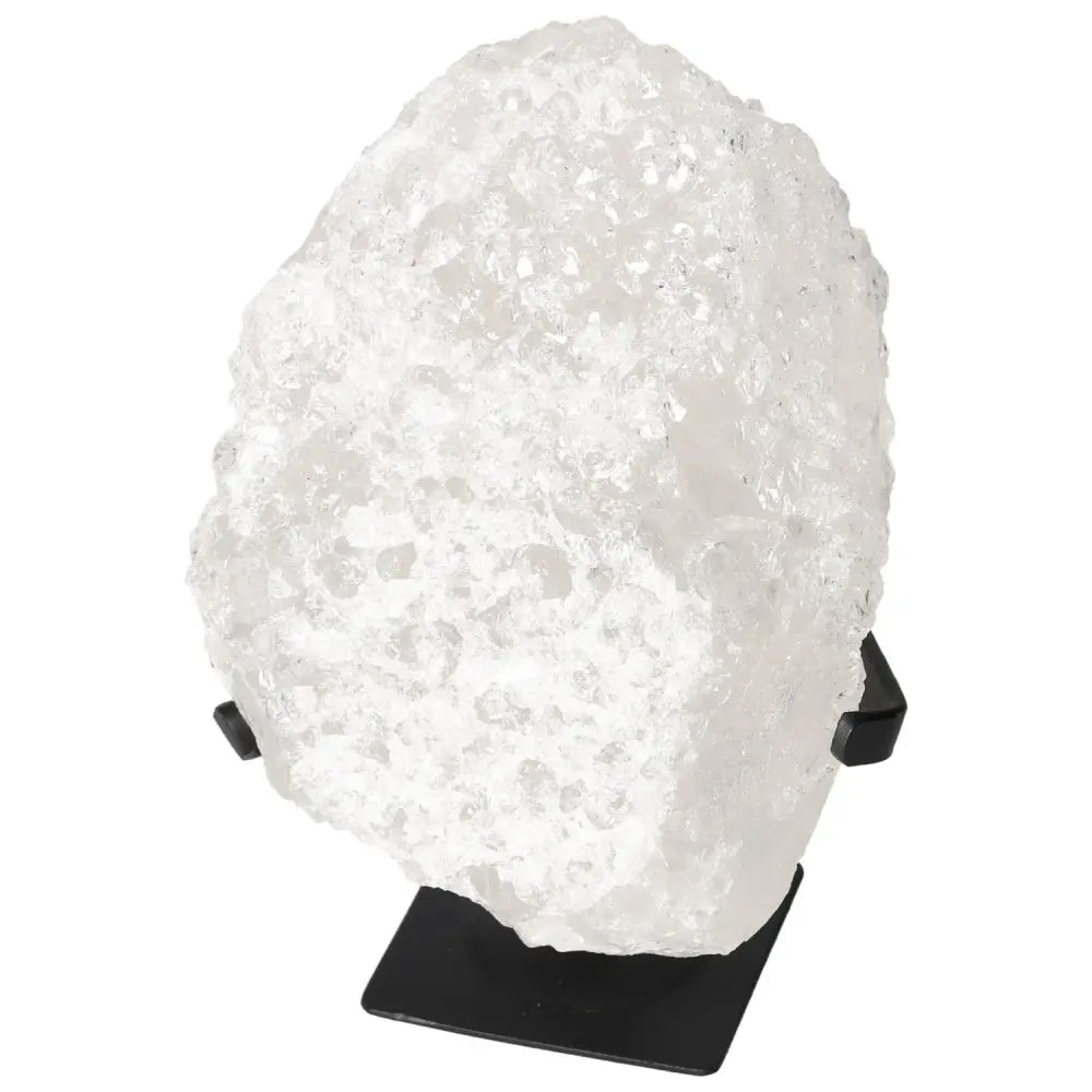 Quartz Crystal Bubble stone on display stand by Sylvia Crystals, known for balancing chakras and enhancing emotional clarity.