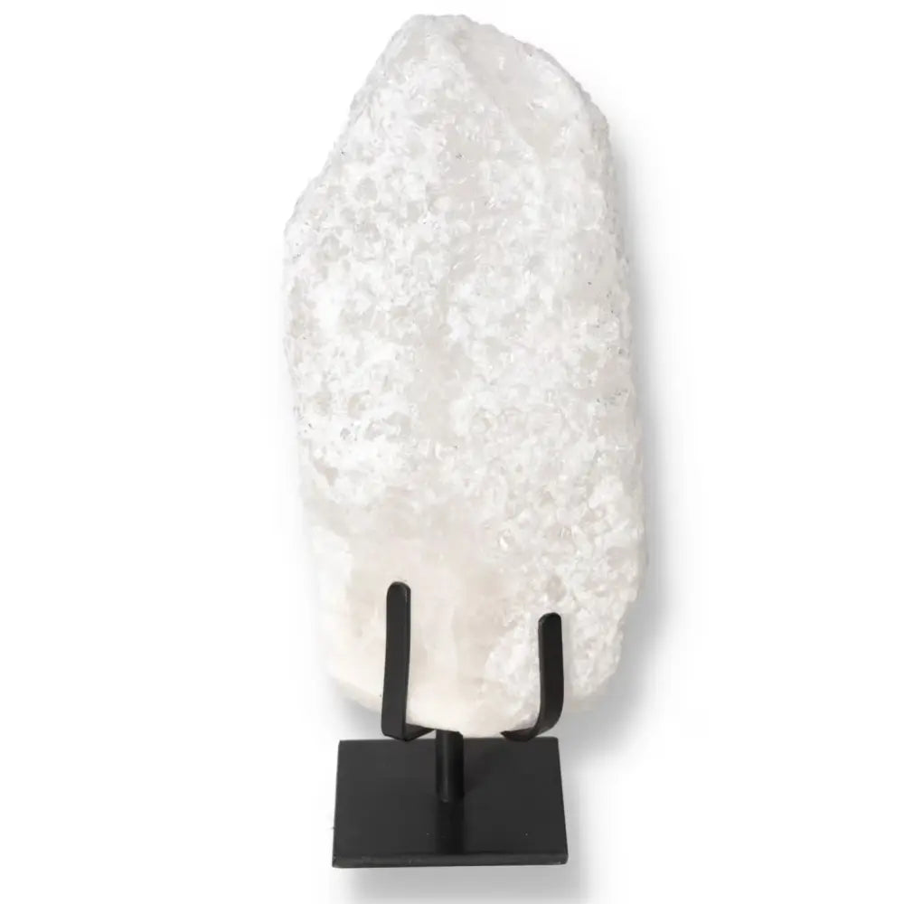 Quartz Crystal Bubble on black stand, showcasing its luxurious and spiritual qualities.