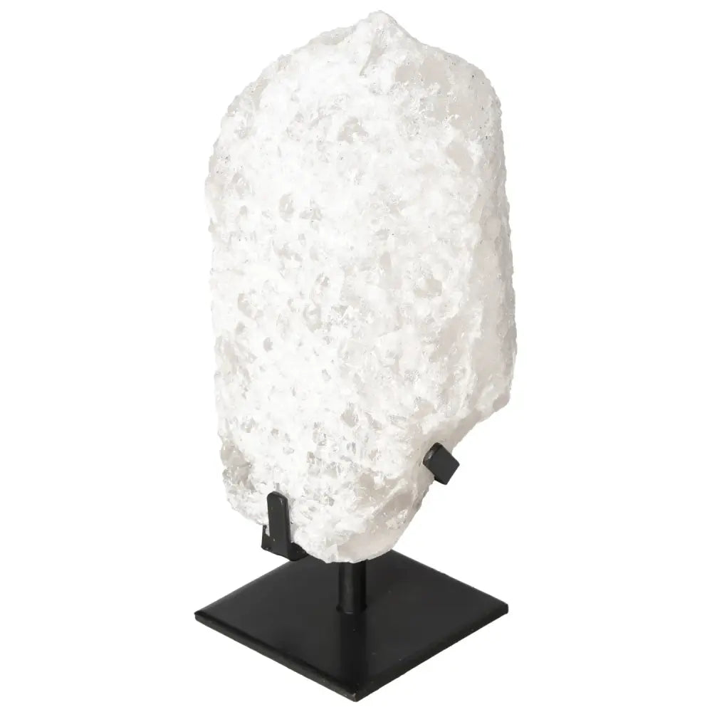 Quartz Crystal Bubble on display stand showcasing its flawless clarity, ideal for spiritual energy and equilibrium. Artisanal elegance by Sylvia Crystals.