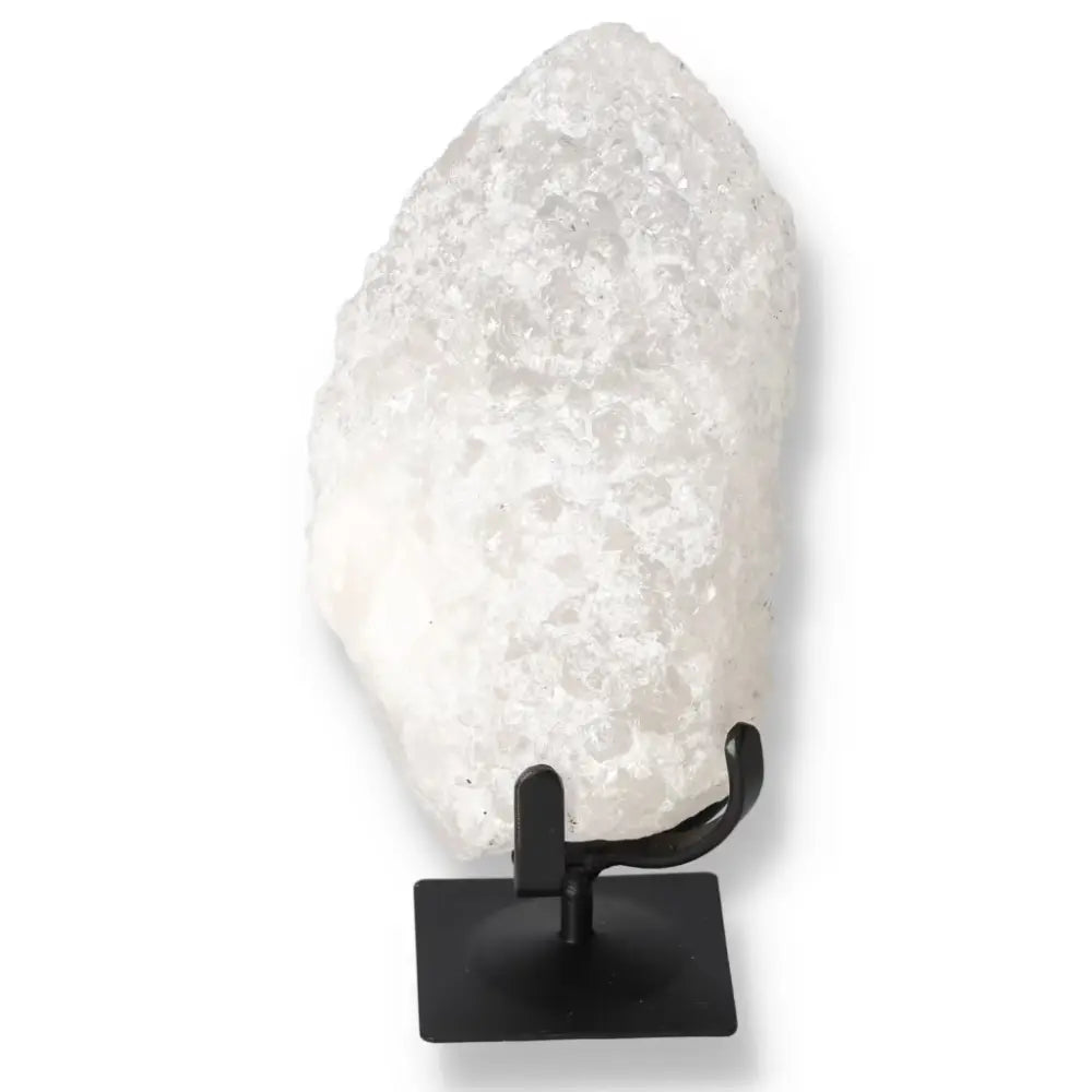 Elegant Quartz Crystal Bubble on a black metal stand, offering timeless beauty and spiritual benefits by Sylvia Crystals.