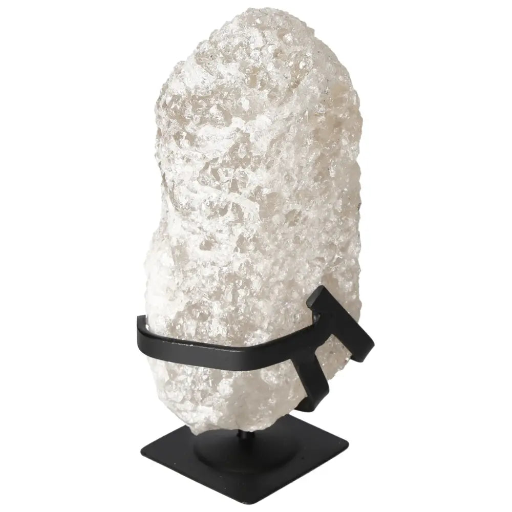 Quartz Crystal Bubble on display stand, featuring textured surface for energy resonance. Premium gemstone accessory by Sylvia Crystals.