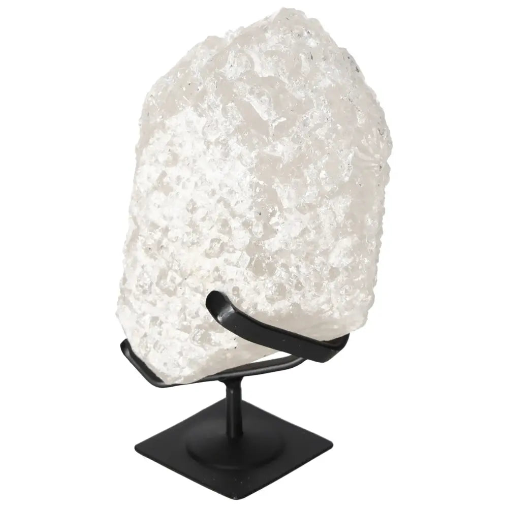 Quartz Crystal Bubble by Sylvia Crystals on stand, showcasing radiant clarity and spiritual resonance for luxury and well-being enhancement.