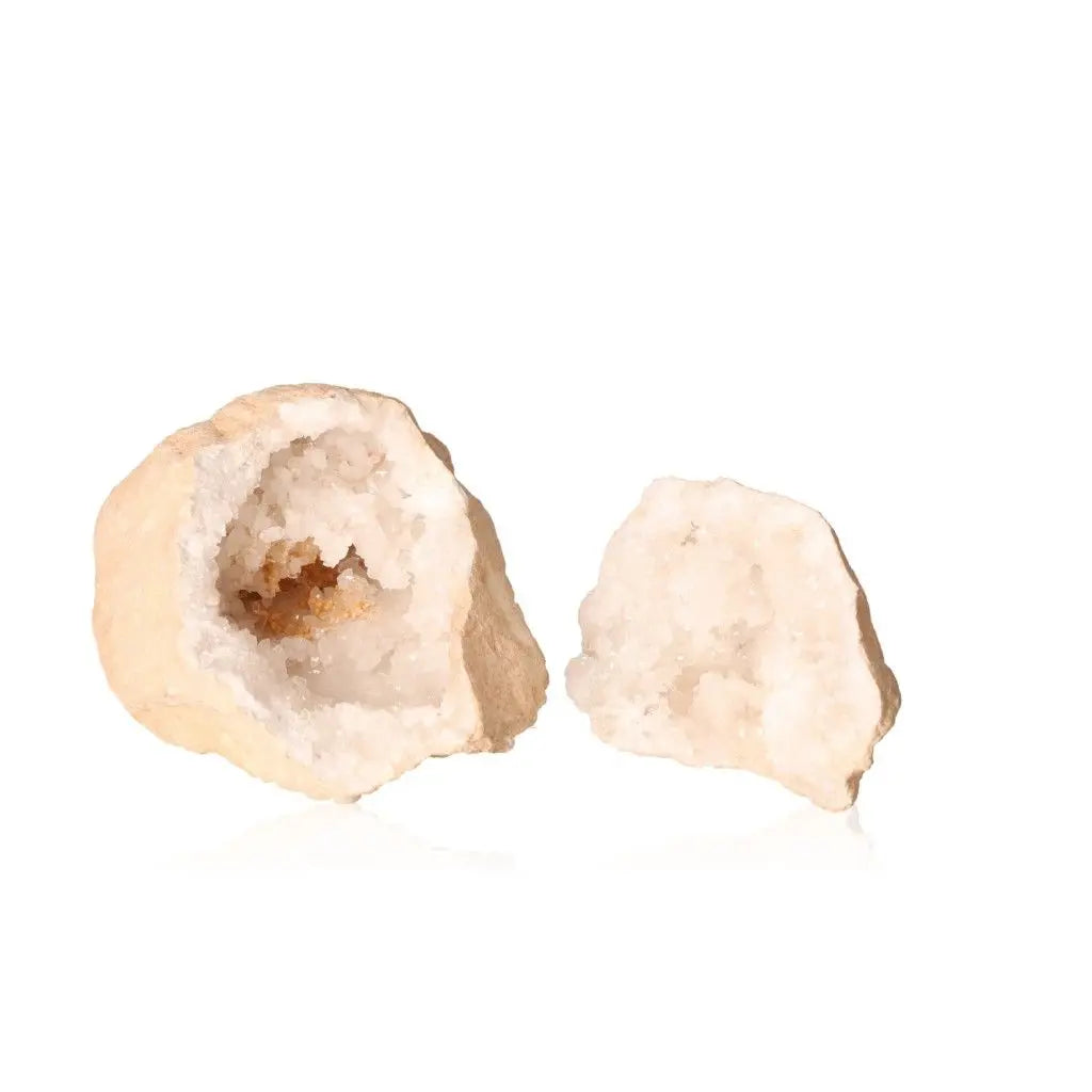 Open Quartz Geode (1200-2000g) revealing milky white crystals, showcasing natural beauty and earthy textures.