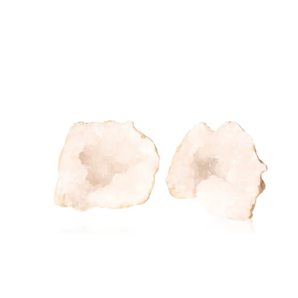 Two halves of a luminous Quartz Geode revealing sparkling white crystals, weighing 1200-2000g, perfect for energy amplification and elegance.