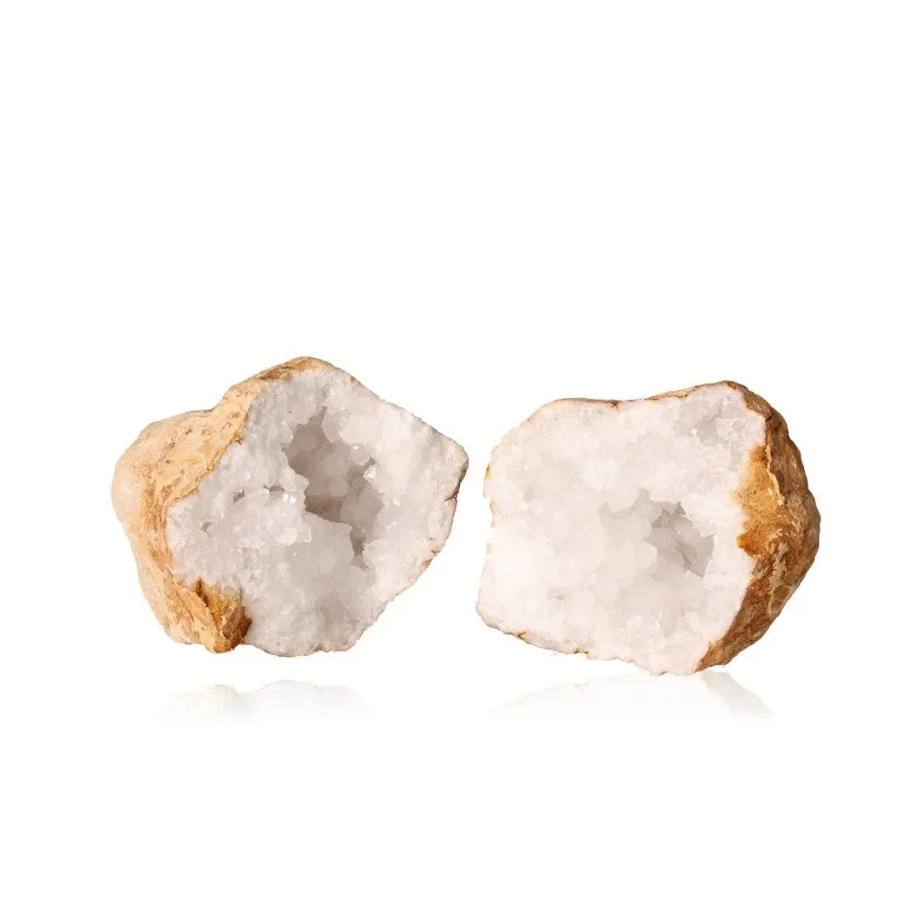 Quartz Geode split open revealing cloudy white crystals, showcasing nature's hidden beauty and unique geological formations.