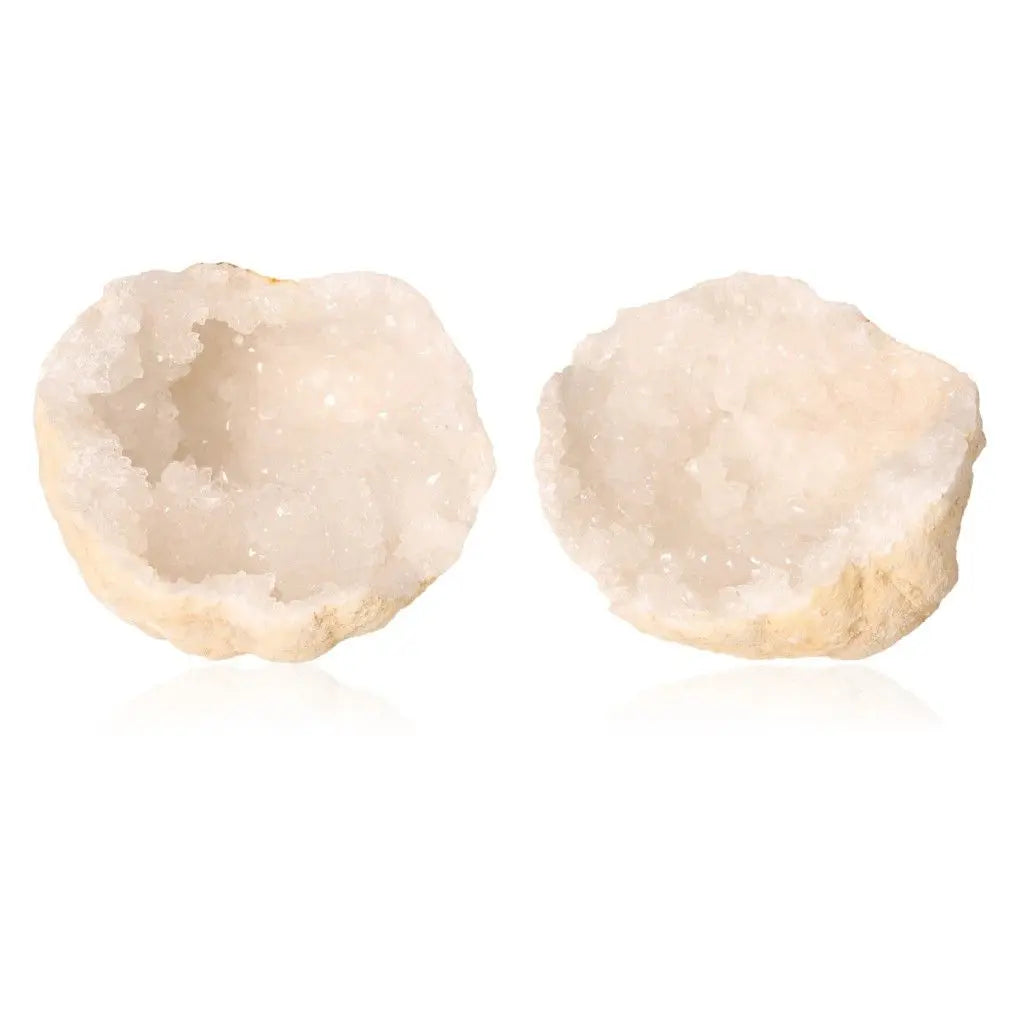 Quartz geode split open revealing cloudy white crystals, showcasing natural beauty and purifying energy; ideal for collectors.