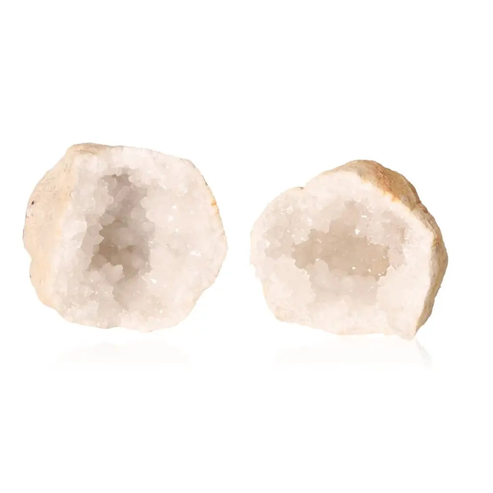 Open quartz geode displaying sparkling white crystals and rugged outer shell, perfect for energy purification and amplification.