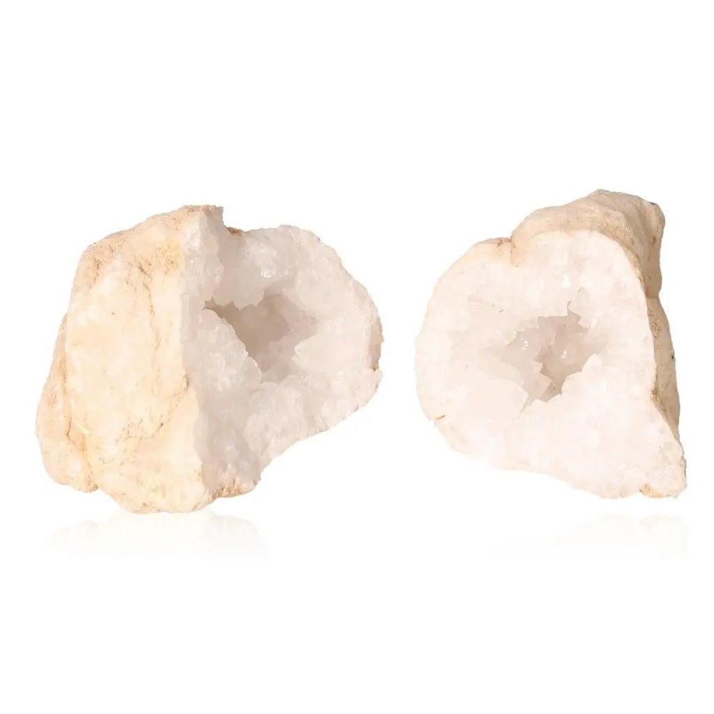 Quartz geode split open showcasing sparkling white crystals, weighing 400-600g, with earthy exterior and tranquil interior.