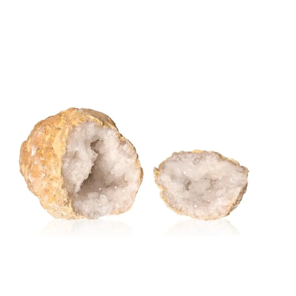 Quartz geode showcasing sparkling white crystals inside rugged outer shell.