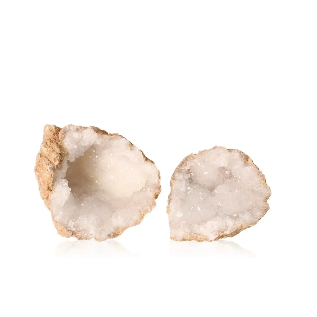 Quartz geode split open revealing sparkling, cloudy white crystals inside rugged earthy shell, weighing 700-900g.