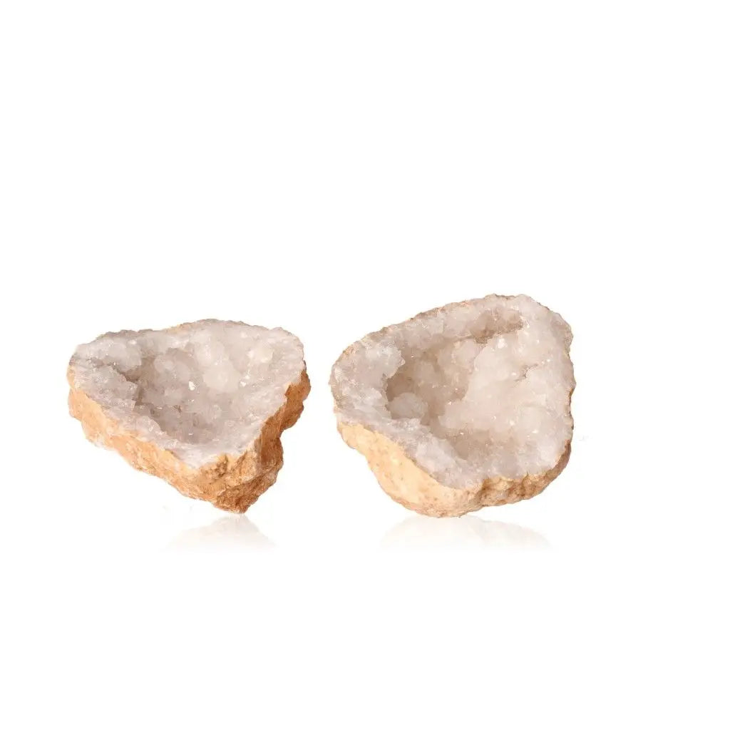 Quartz geodes with rugged shells and sparkling white crystals, offering a glimpse into nature's wonders; weighs 900-1200g.