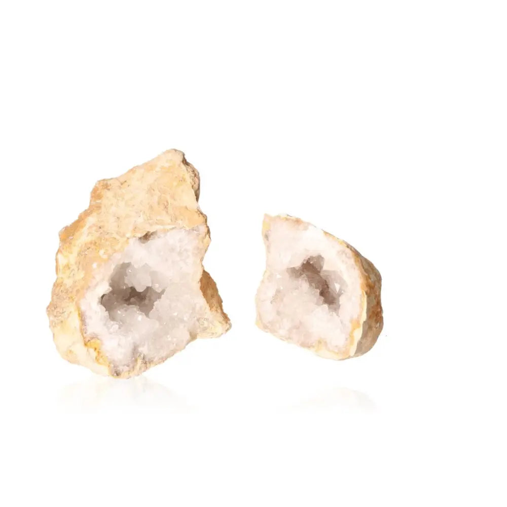 Quartz geode showcasing sparkling white crystals inside an earthy shell, weighing between 900-1200 grams.