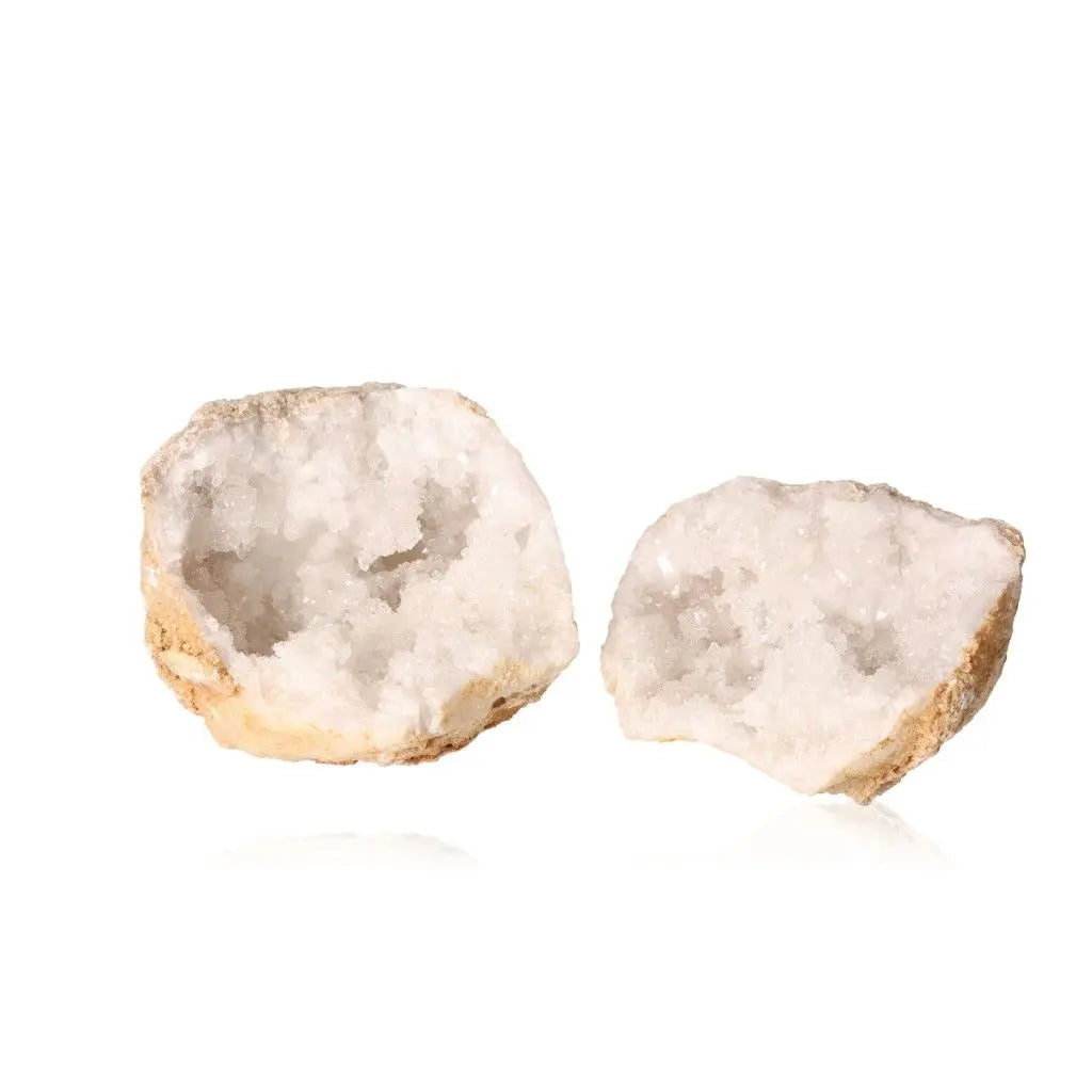 Open quartz geode displaying sparkling white crystals, showcasing natural beauty and elegance.