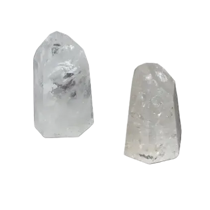 Two clear quartz obelisks weighing 1 kg each, known for purification and harmonizing energy, against a dark background.