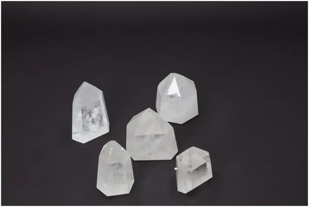 Set of five quartz obelisks, each weighing 1 kg, showcasing varied colors and elements, enhancing chakra and zodiac energy balance.