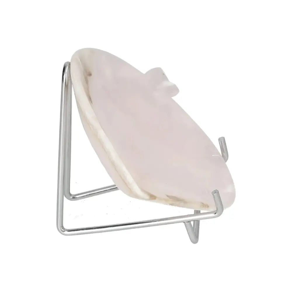 Rose onyx platter with unique veining and smooth polished surface, displayed on a metal stand, perfect for serving or decor.