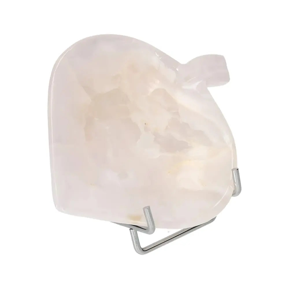 Exquisite rose onyx platter with polished surface, showcasing unique color variations and veining, displayed on a metal stand.