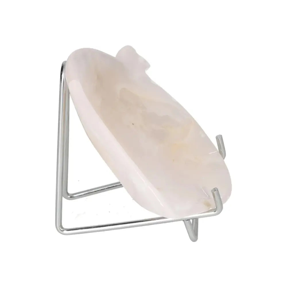 Rose Onyx Platter with a polished surface on a metal stand, showcasing its unique color variations and elegant design.