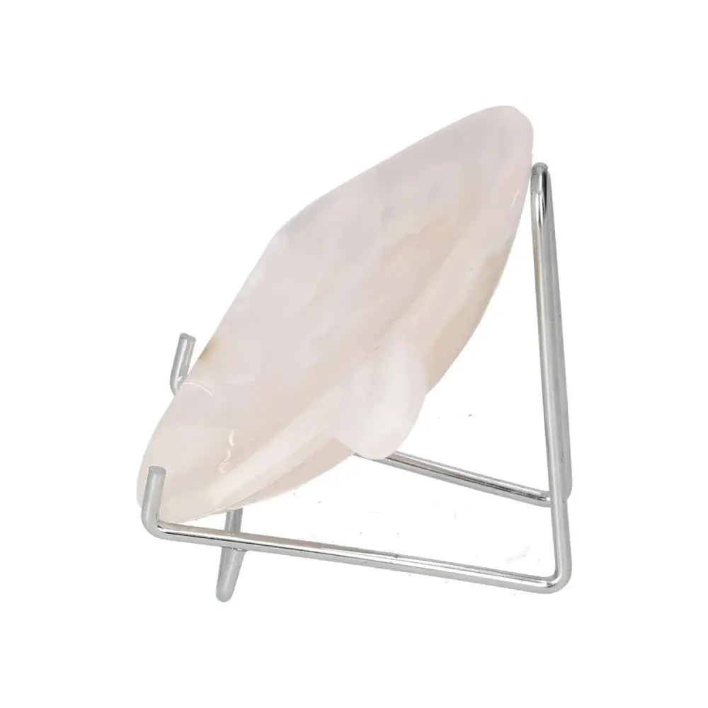 Side view of a rose onyx platter on a metal stand, featuring intricate veining and a smooth polished surface, ideal for elegant tablescapes.