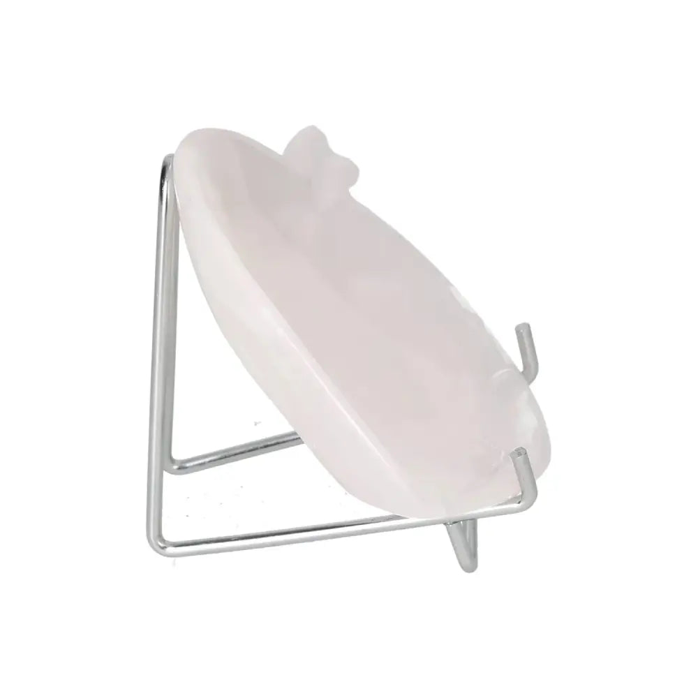 White plate displayed on a metal stand, showcasing its elegant design.
