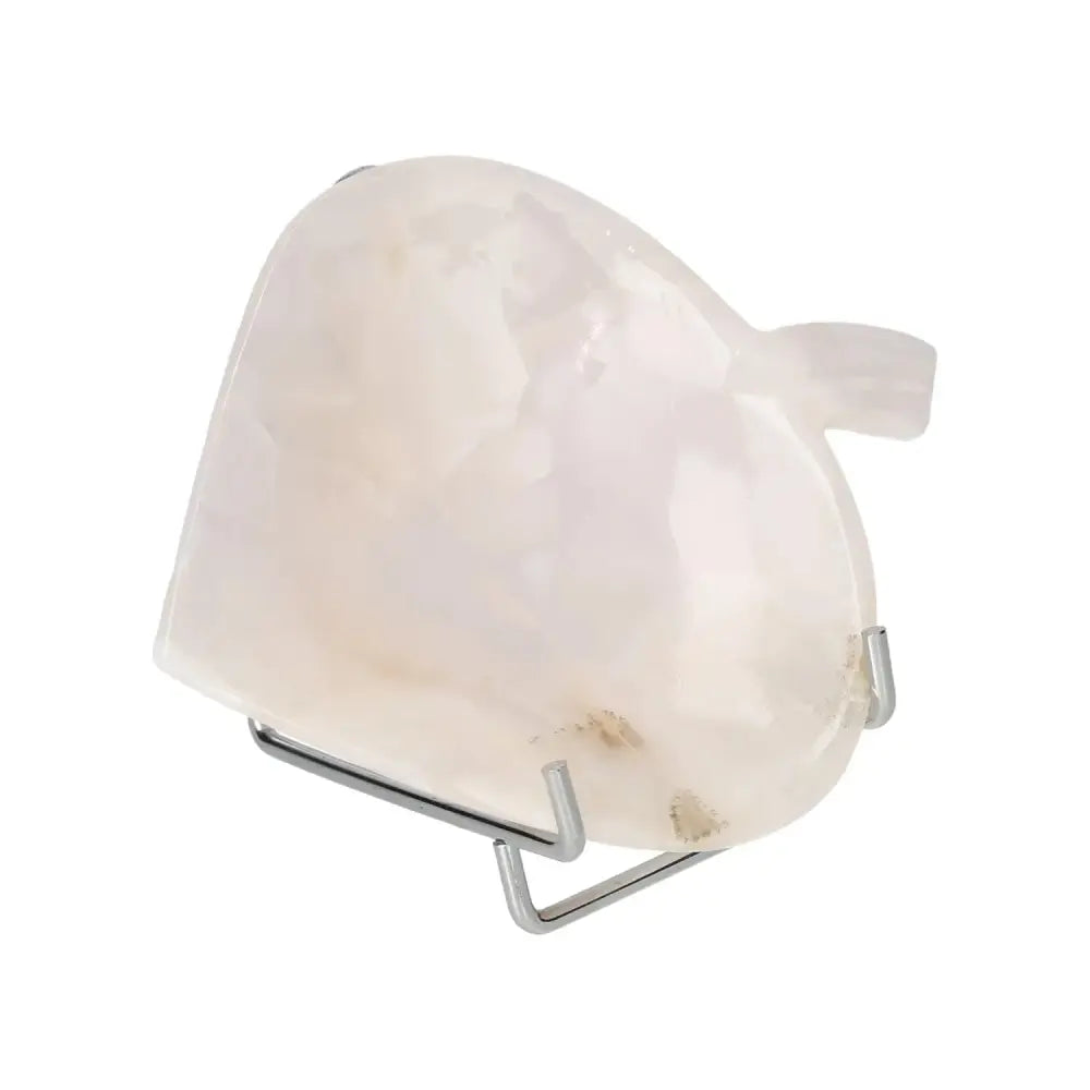 Rose onyx heart-shaped platter on display stand, showcasing natural variations and polished finish, perfect for elegant table settings.