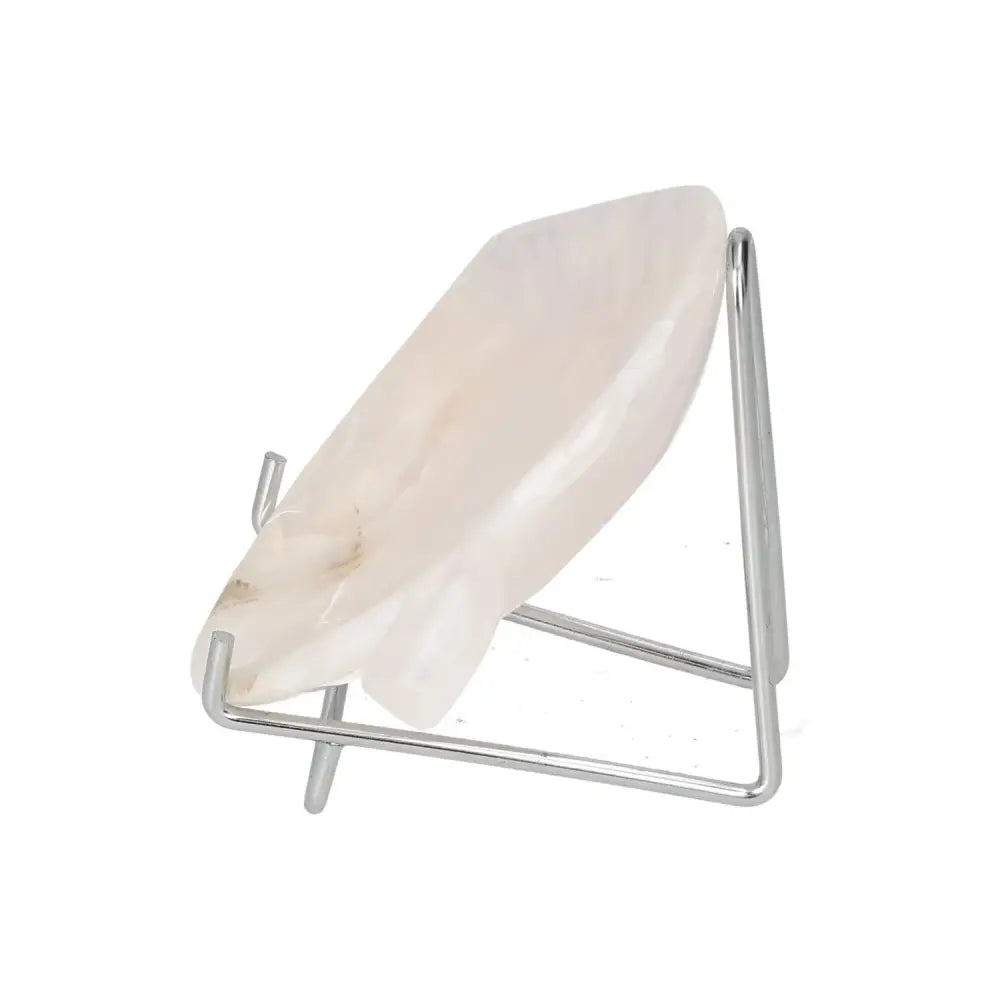 Rose Onyx Platter with polished surface on metal stand, showcasing unique color variations and veining, reflecting light elegantly.