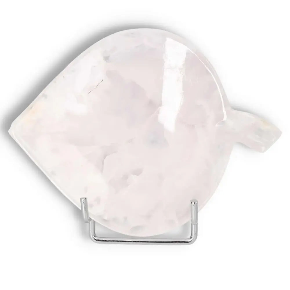 Rose onyx platter with unique veining and polished surface on display stand