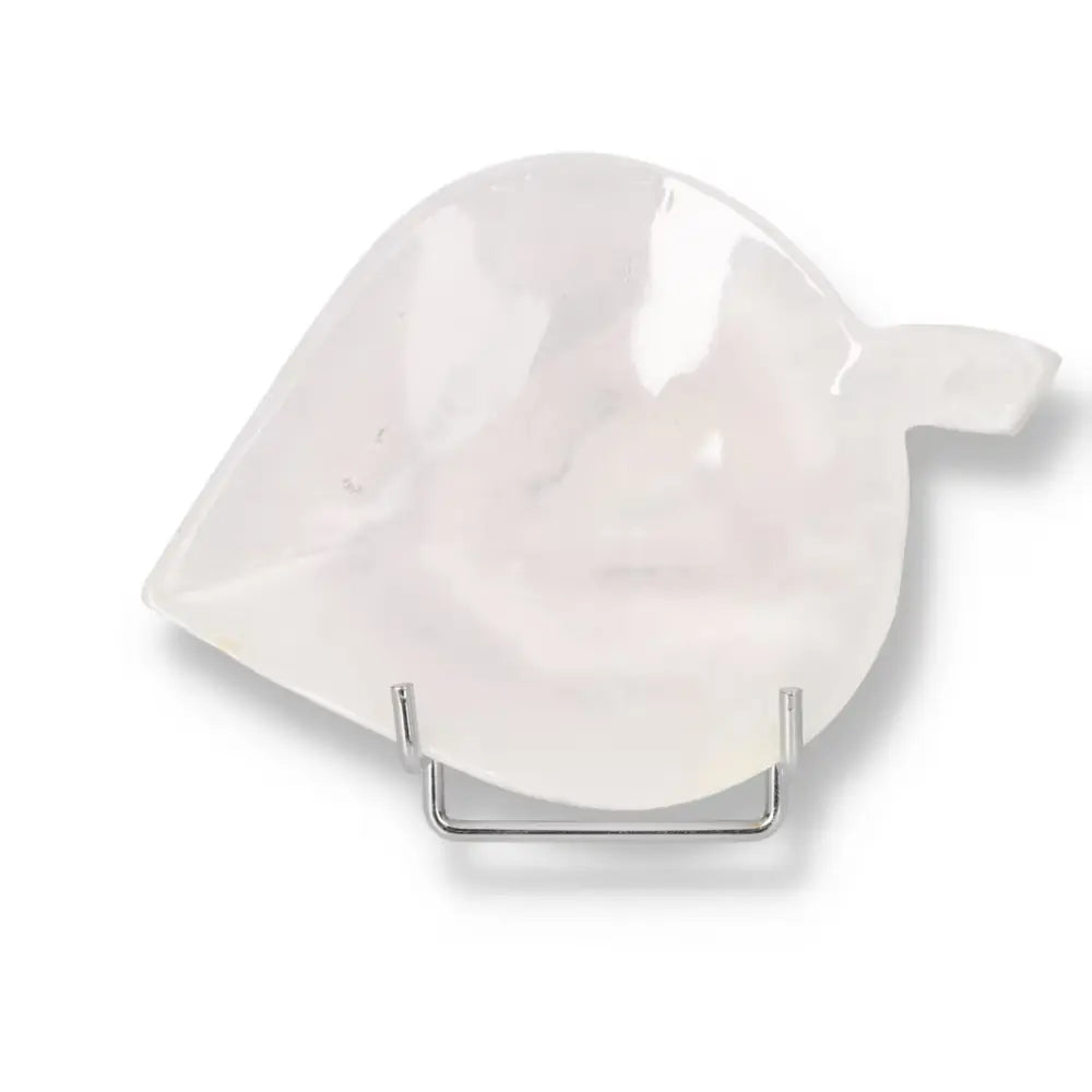Leaf-shaped rose onyx platter with a smooth, polished surface and natural veining, perfect for elegant tablescape decor.
