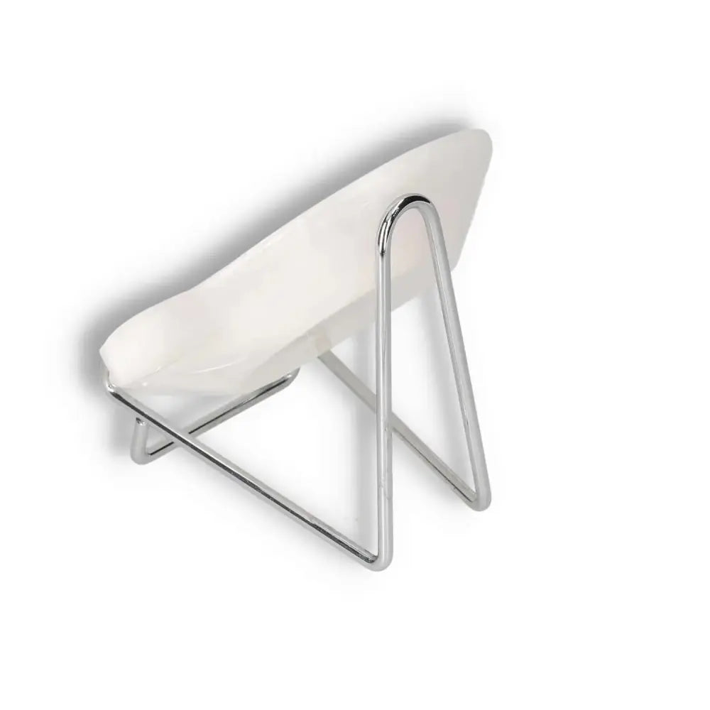 Modern white chair with sleek metal legs in a minimalist design, perfect for contemporary interiors.