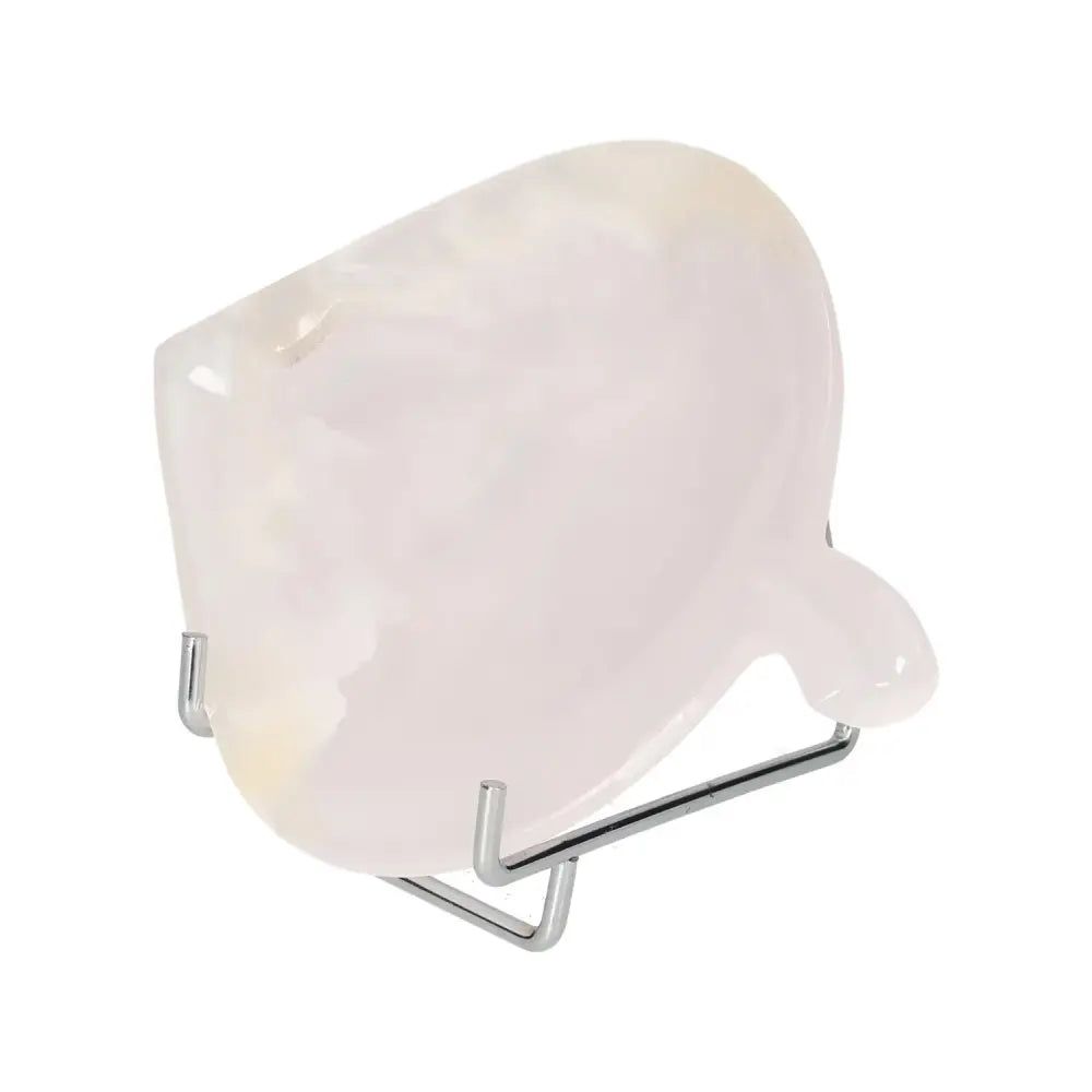 Elegant Rose Onyx Platter displayed on a metal stand, showcasing its natural patterns and soft hues, ideal for decor or serving.