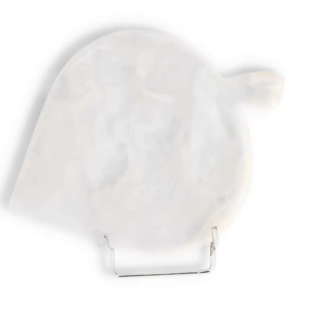 White onyx platter displayed on a stand against white background, showcasing its elegant marbled texture and smooth finish.