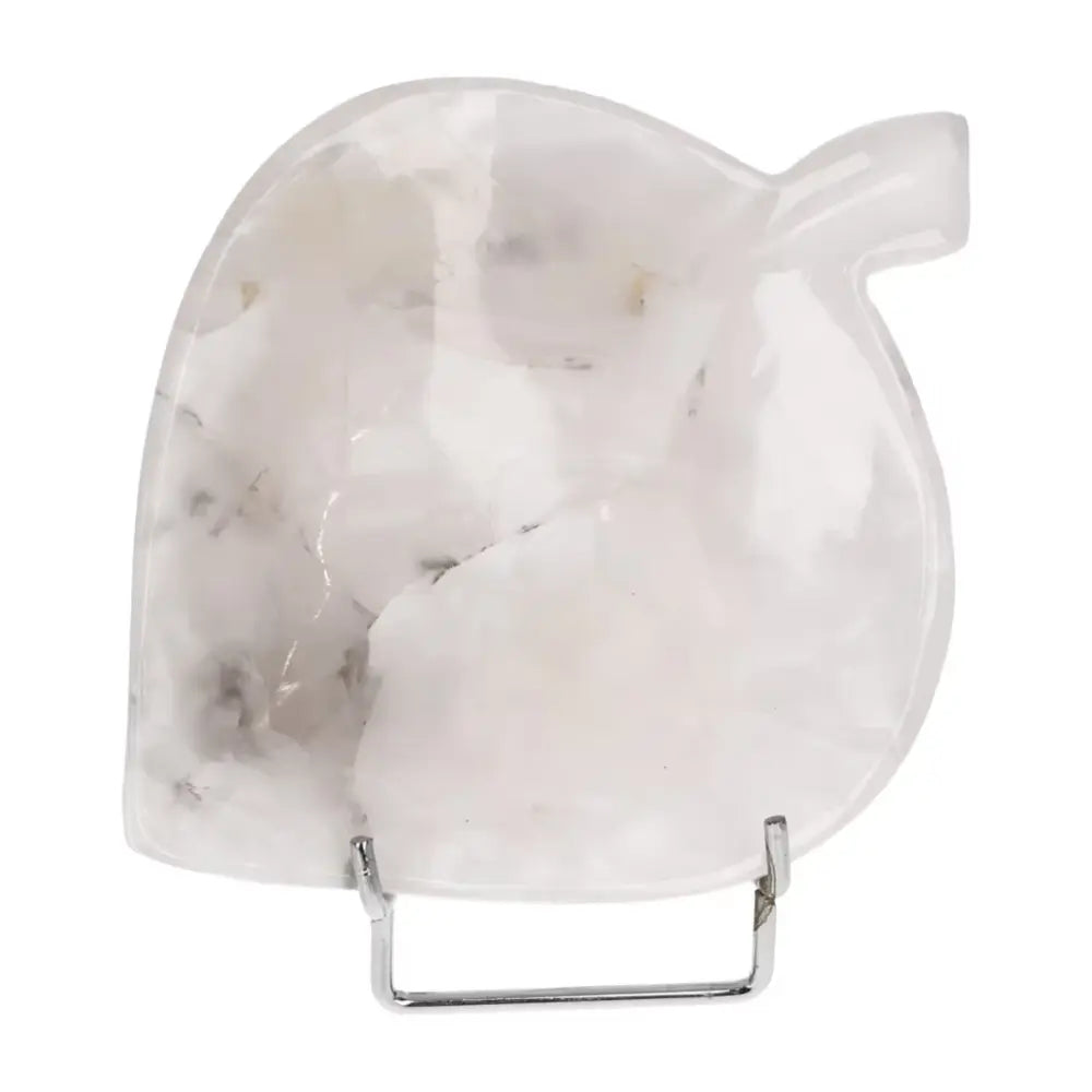 Rose onyx platter with unique veining, polished surface reflecting soft light, perfect for elegant serving; exquisite artistry and natural beauty.