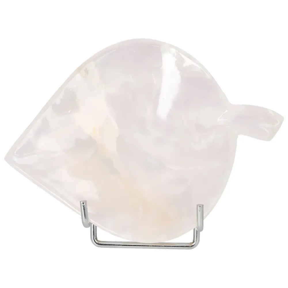 Rose Onyx Platter with unique veining on a stand, showcasing its elegant, polished surface and warm, delicate charm for table decor.