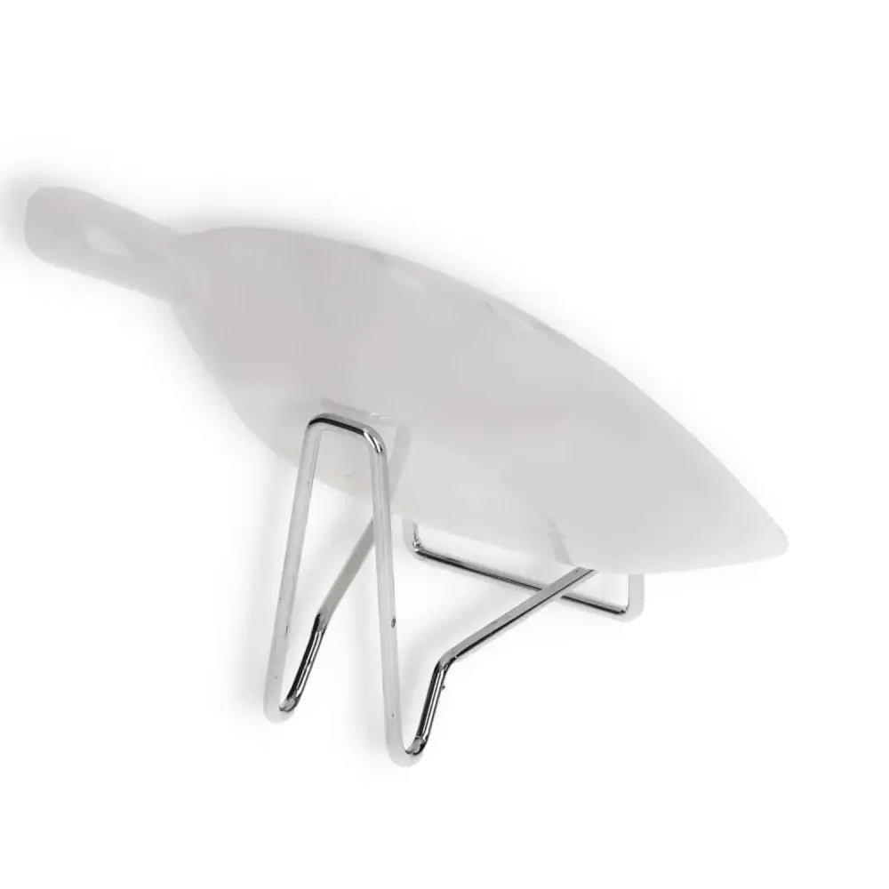 Minimalist white ceramic platter on a sleek silver stand