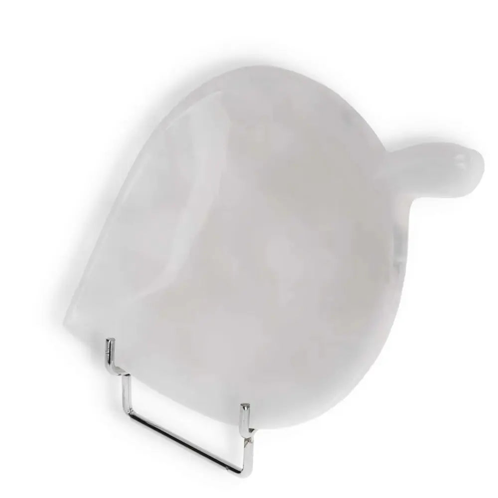 White onyx platter in an elegant bird shape on a metal stand, showcasing smooth texture and natural veining.