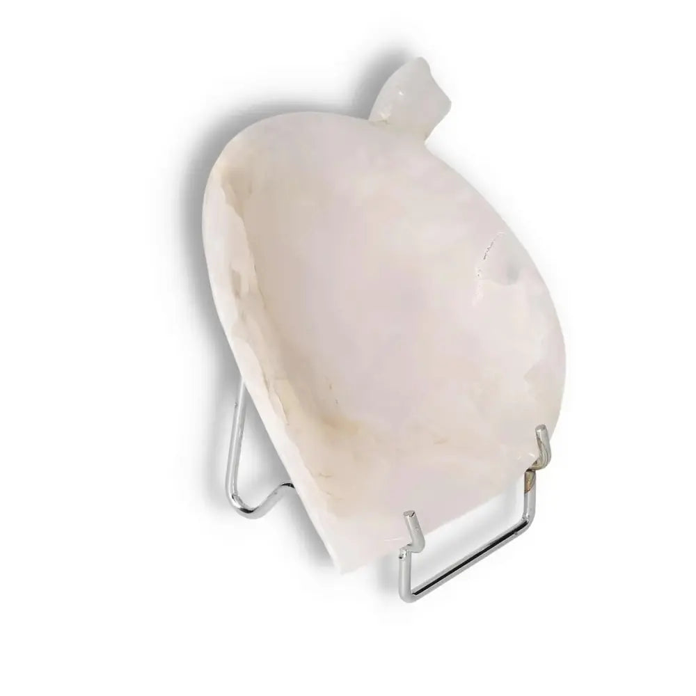 Rose onyx platter with unique veining, polished finish, displayed on a stand, ideal for elegant dining or decor enhancement.