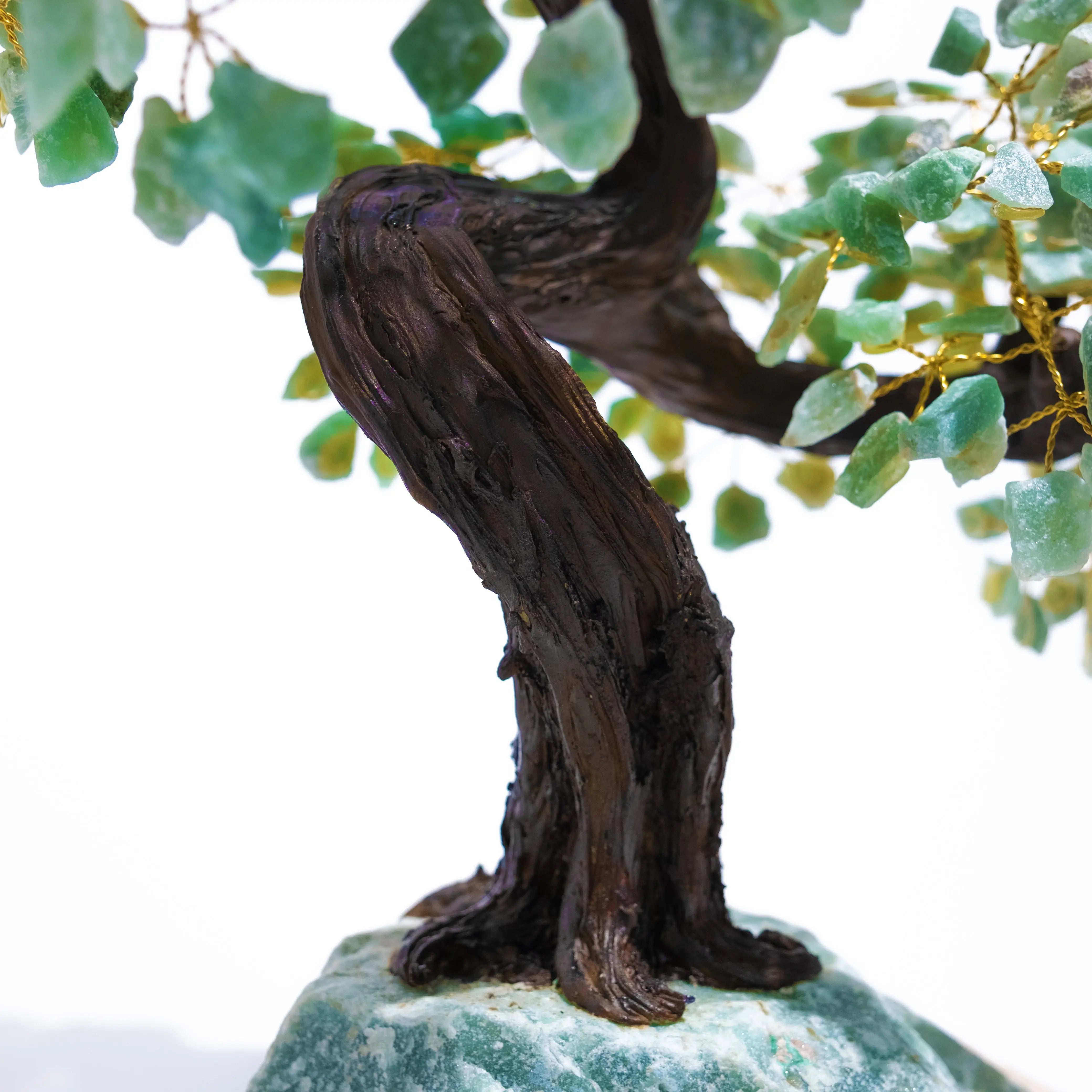 Detailed view of green aventurine crystal bonsai tree trunk, symbolizing growth and prosperity.